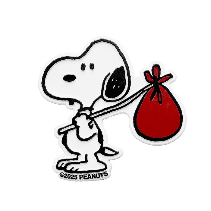 Snoopy pulling a red bindle on a stick in a nomad style fridge magnet