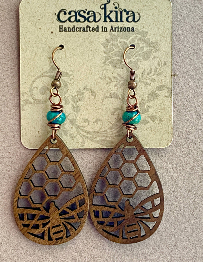 Copper ear wires with coiled details, blue jasper beads, and honeycomb cutout wooden teardrop charms