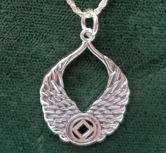 Silver WINGS WITH NA SYMBOL PENDANT - nawears