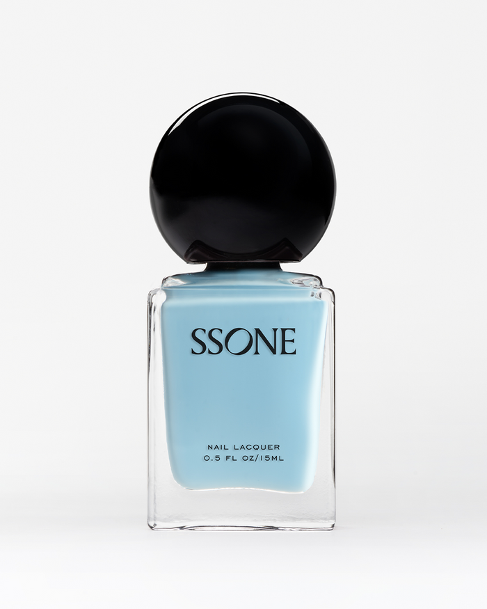 SSONE light blue nail polish bottle with black cap on a white background