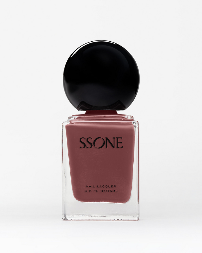 SSONE dusty rose-colored nail polish bottle with black cap on a white background