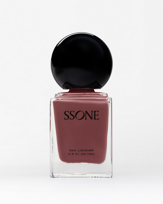 SSONE dusty rose-colored nail polish bottle with black cap on a white background