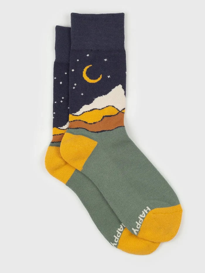 Starry Night Socks in navy with a yellow crescent moon and snowy mountains