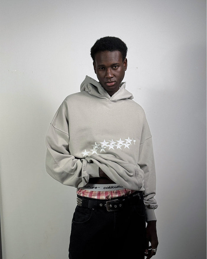 STARS HOODIE PALE GREY - pale grey star print hoodie, front view on male model - Cold Culture