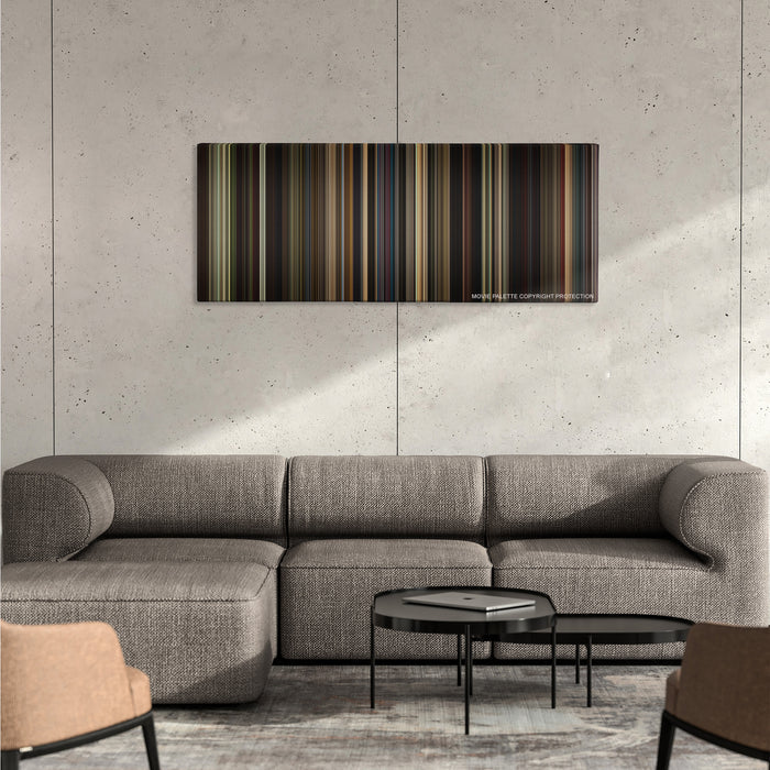 Straight Outta Compton color palette canvas on a concrete wall above a gray sectional sofa