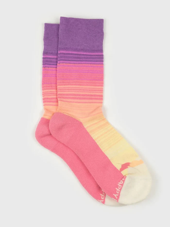 Sunrise Socks with purple cuff and pink to orange gradient stripes on the foot