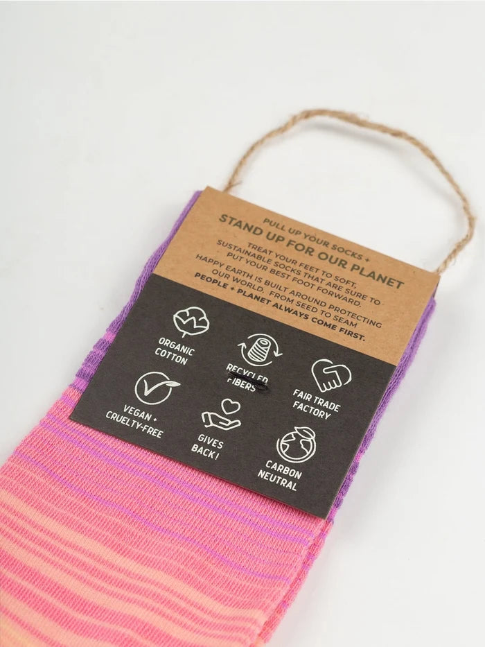 Sunrise Socks featuring purple pink gradient fabric with a brown cardboard tag and twine