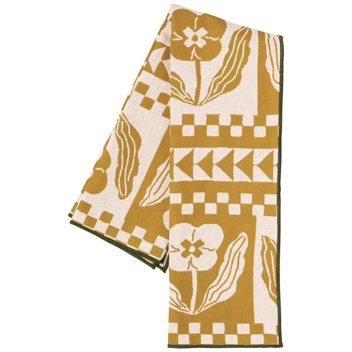 Teppi double cloth dish towel with mustard and cream floral and geometric print and a dark green border.