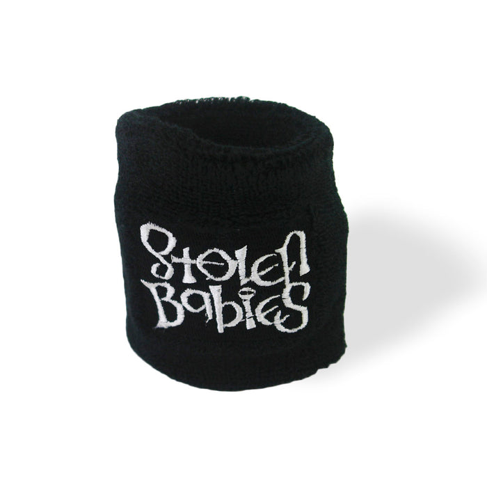 A black wristband from Stolen Babies features “Stolen Babies” embroidered in white, stylized lettering. It is shown on a plain white background with a faint shadow underneath.