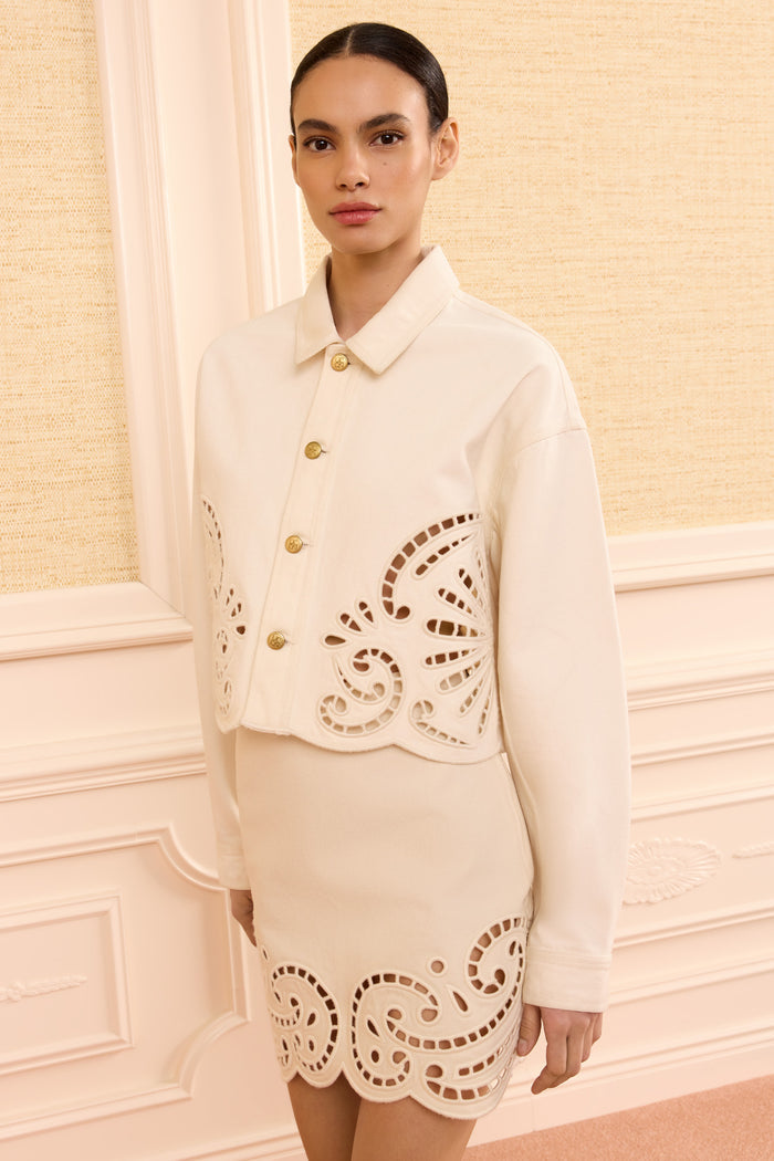 Cowrie Eyelet Denim Jacket - Three-Quarter On Model with Matching Skirt | Ulla Johnson