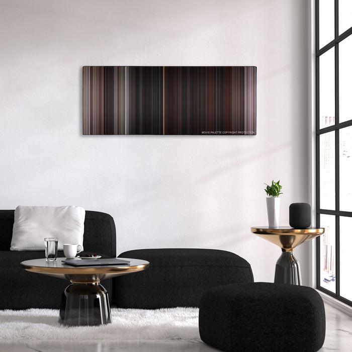The Goonies color palette canvas above a black sofa with a gold-topped table