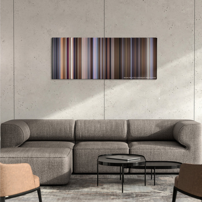 The Talented Mr. Ripley color palette canvas on a concrete wall above a gray sectional sofa