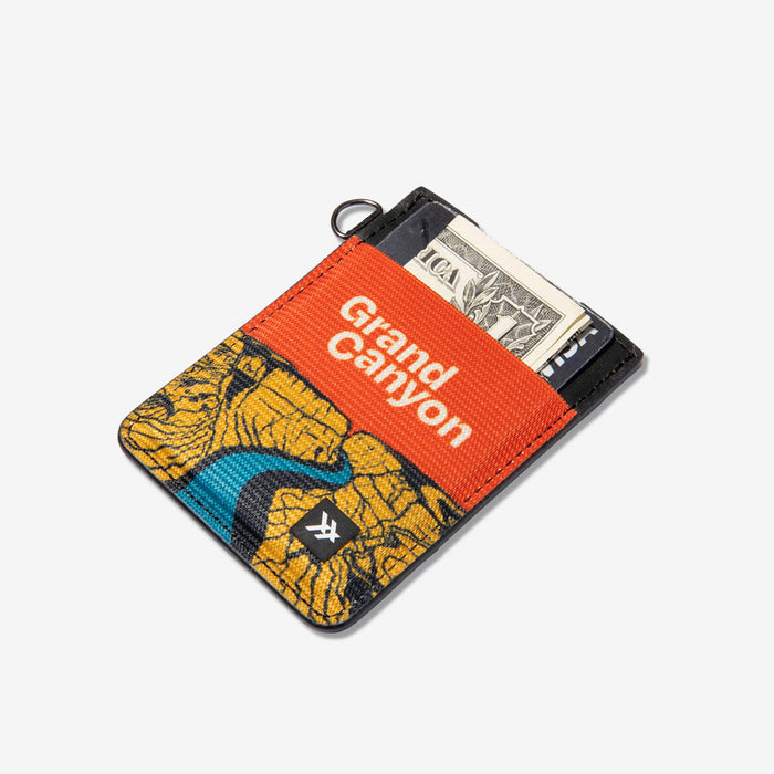 Vertical leather elastic wallet from National Parks collection in bright orange with Grand Canyon artwork.