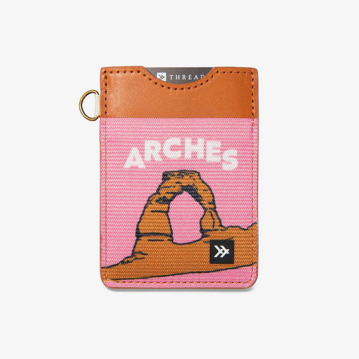 Arches National Park themed vertical wallet with pink fabric body and tan leather top