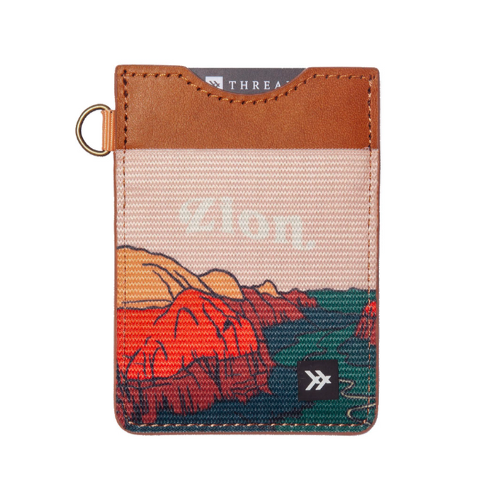 Arches National Park vertical wallet with canyon landscape on pink beige fabric and tan leather top