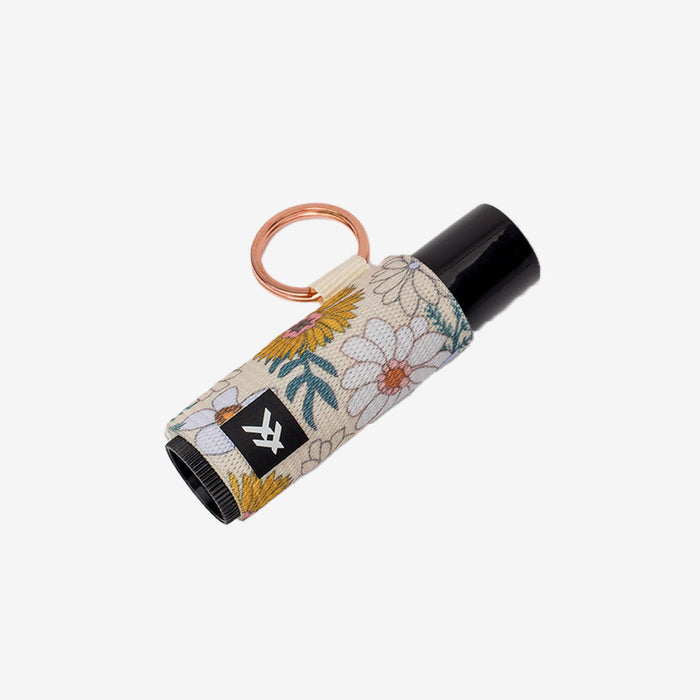 Beige floral lip balm holder with copper ring and black cap