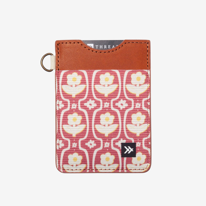 Thread Patterned vertical leather elastic wallet with pink floral fabric and tan leather top plus brass key ring