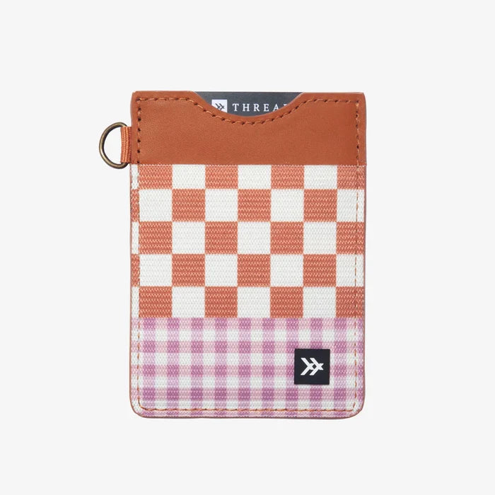 Front view of Thread Patterned Vertical Leather Elastic Wallet featuring orange and white checkered panel with purple gingham bottom and leather trim.