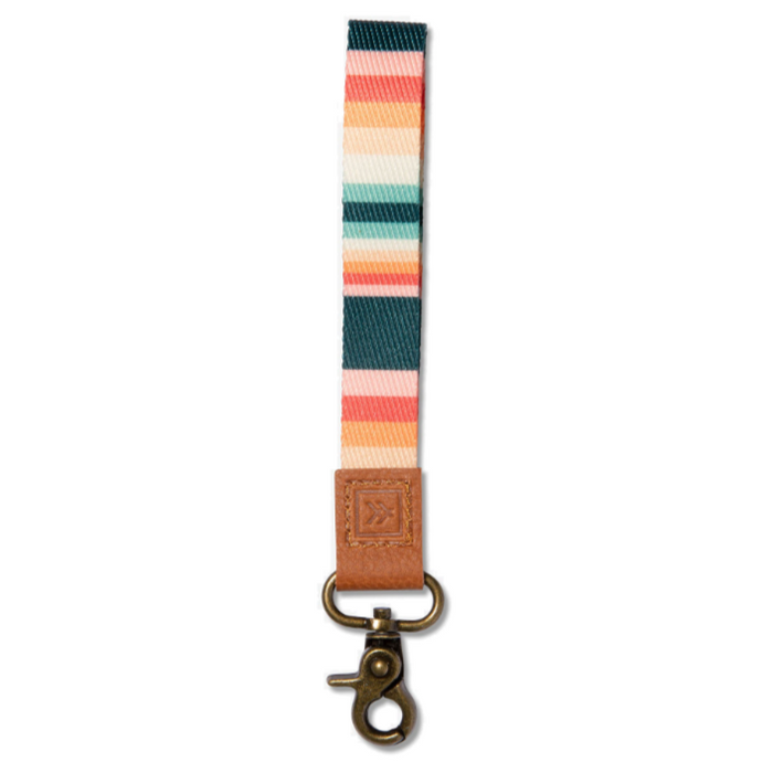 Striped multicolor wrist lanyard with tan leather tab and brass clip
