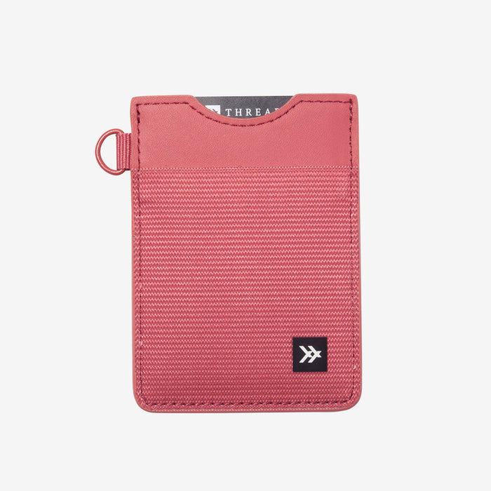 Pink vertical leather elastic wallet with a left side key ring and small logo patch