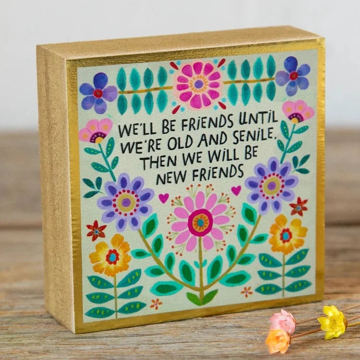 Tiny block keepsake with a colorful floral design and friendship quote framed in gold