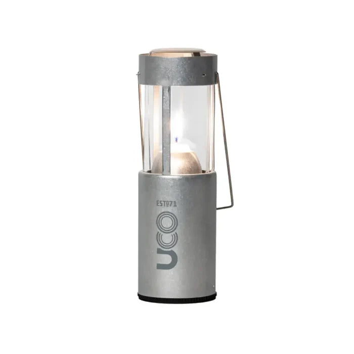 UCO Original Candle Lantern set-up with a lit candle in raw aluminium on a white background