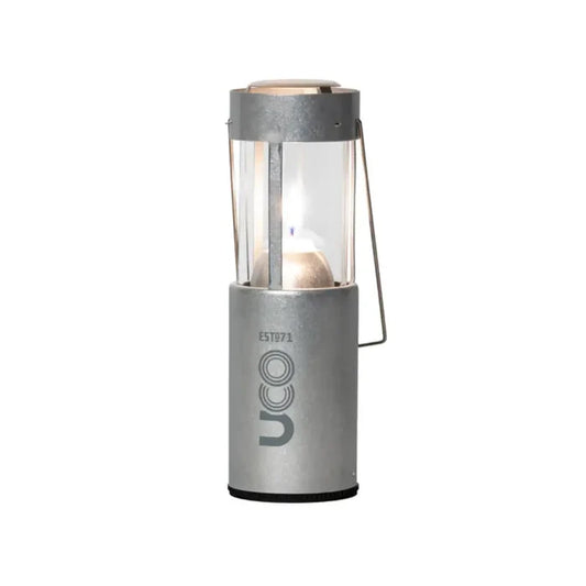 UCO Original Candle Lantern set-up with a lit candle in raw aluminium on a white background