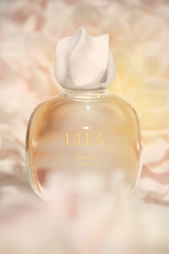 ULLA Baroque Garden Designer Perfume Bottle Among Soft Floral Petals - Lifestyle Detail | Ulla Johnson