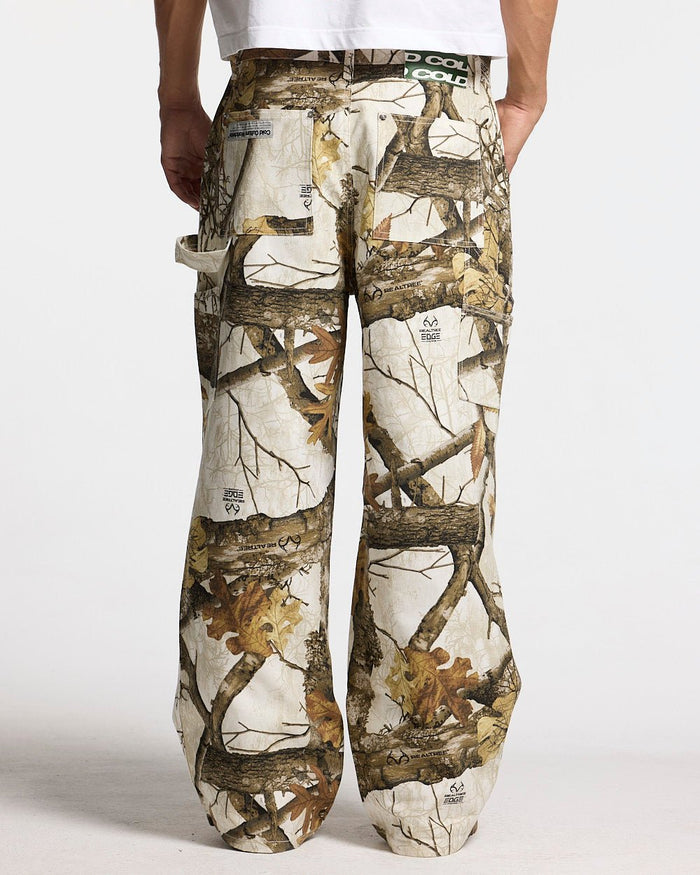 V1 CARPENTER PANTS REALTREE WHITE - white realtree camo carpenter pants, back view on male model - Cold Culture