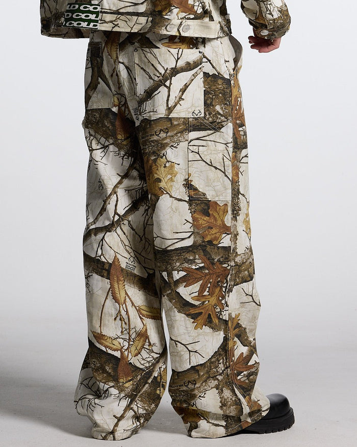 V1 CARPENTER PANTS REALTREE WHITE - white realtree camo carpenter pants, back view on male model - Cold Culture #man