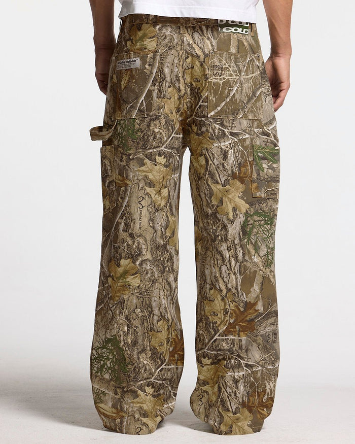 V1 CARPENTER PANTS REALTREE - realtree camo carpenter pants, back view on male model - Cold Culture