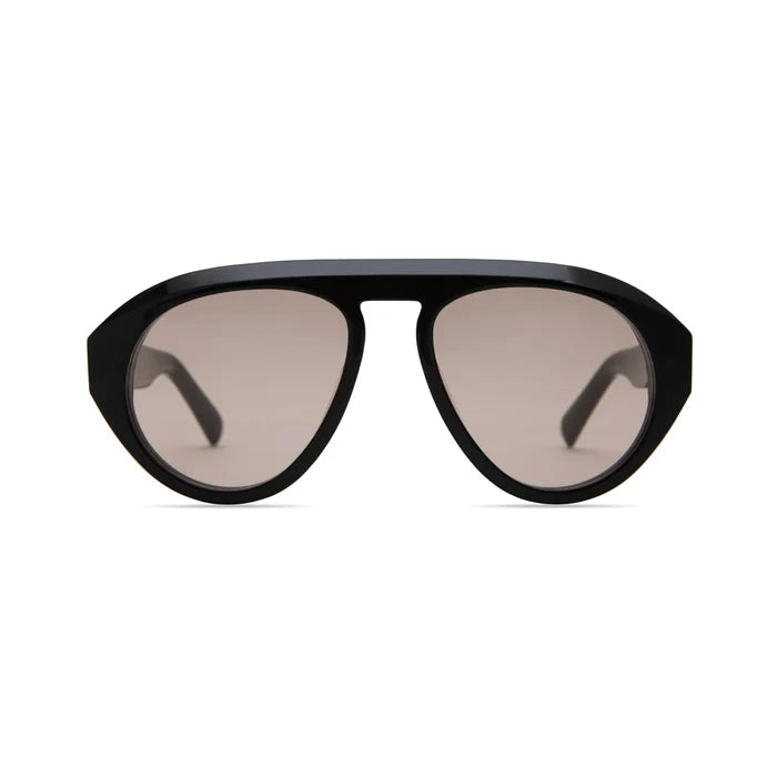 The Val Sunglasses by Elisa Johnson feature oversized black frames, large lightly tinted lenses with UV400 protection, and are shown from the front on a white background.