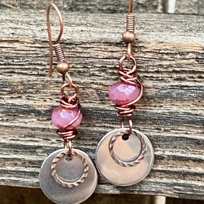 Copper Venus drop earrings with pink beads and layered copper coin charms.