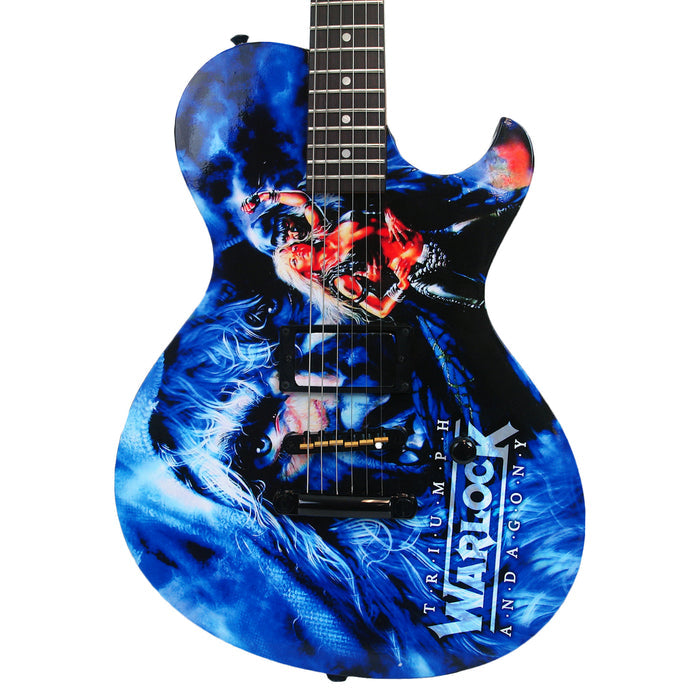 A blue Doro Warlock Guitar featuring dramatic fantasy art of a warrior with a sword and lion, emblazoned with Triumph and Agony—a stunning Limited Edition collectors piece.
