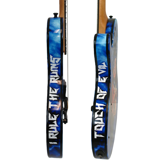 Two electric Doro Warlock Guitars with blue sides: one has I RULE THE RUINS, the other TOUCH OF EVIL in bold, white stylized letters—reflecting Triumph and Agonys spirit.