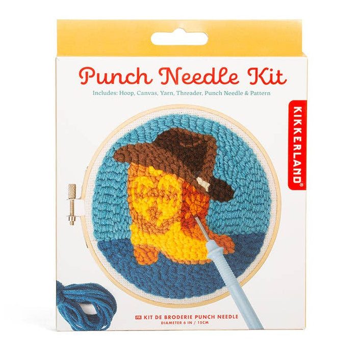 Punch Needle Kit box by Kikkerland with a circular embroidered dog design in an embroidery hoop