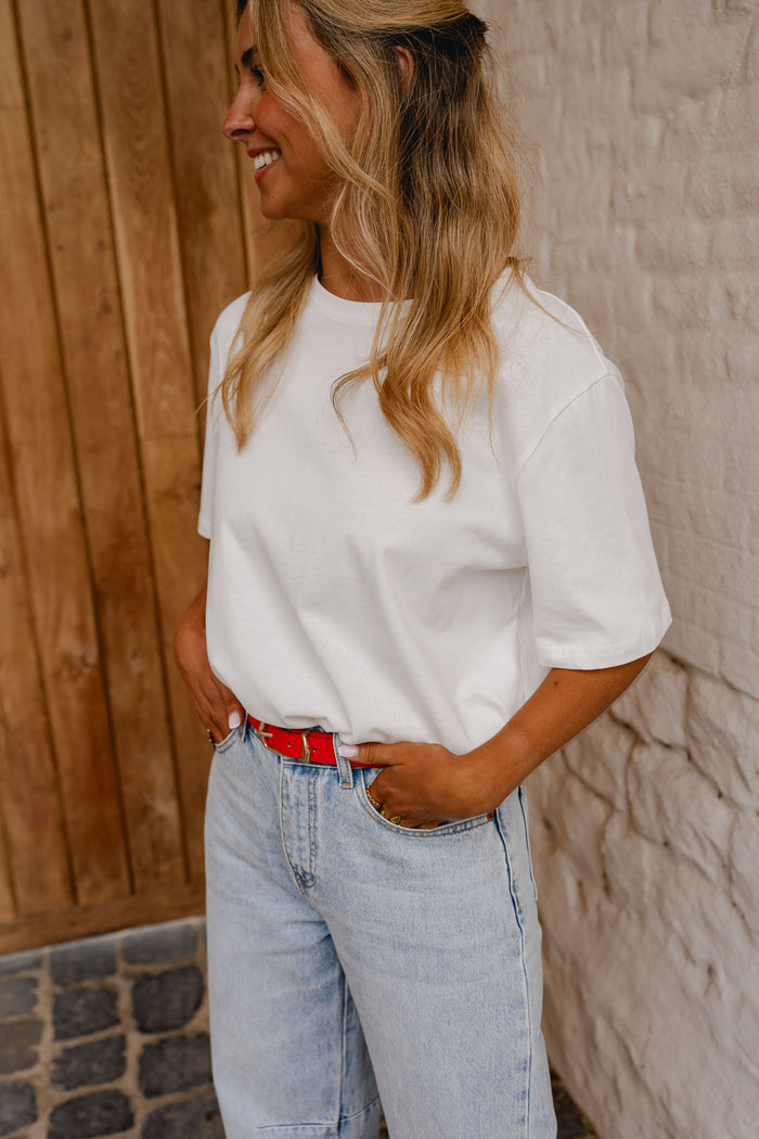 White Naya tee styled with jeans