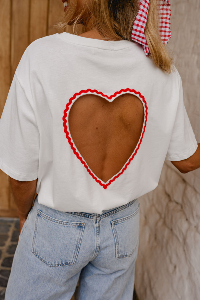 White Naya tee red trim close-up