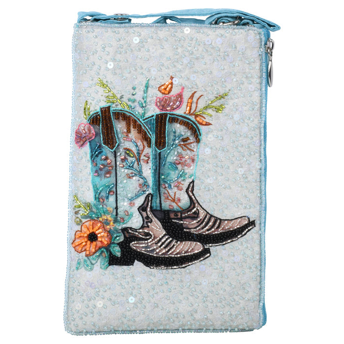 Wild Cowgirl Club Bag beaded clutch with turquoise edging and pale beaded background featuring an embroidered desert scene