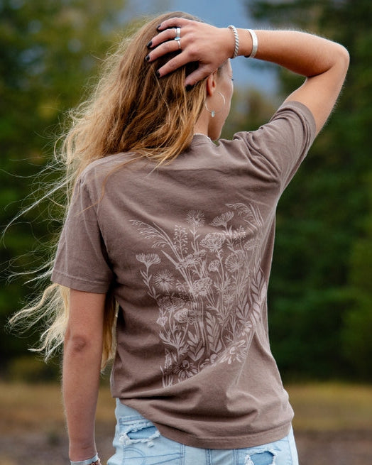 Espresso colored short sleeve tee with a large white botanical print on the back.