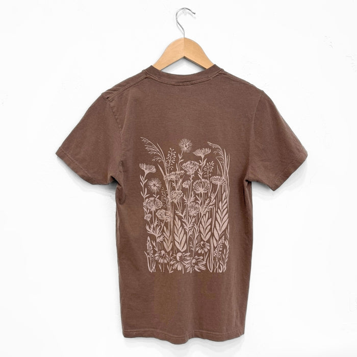 Espresso brown Wild Field unisex tee with a pale botanical print on the back.