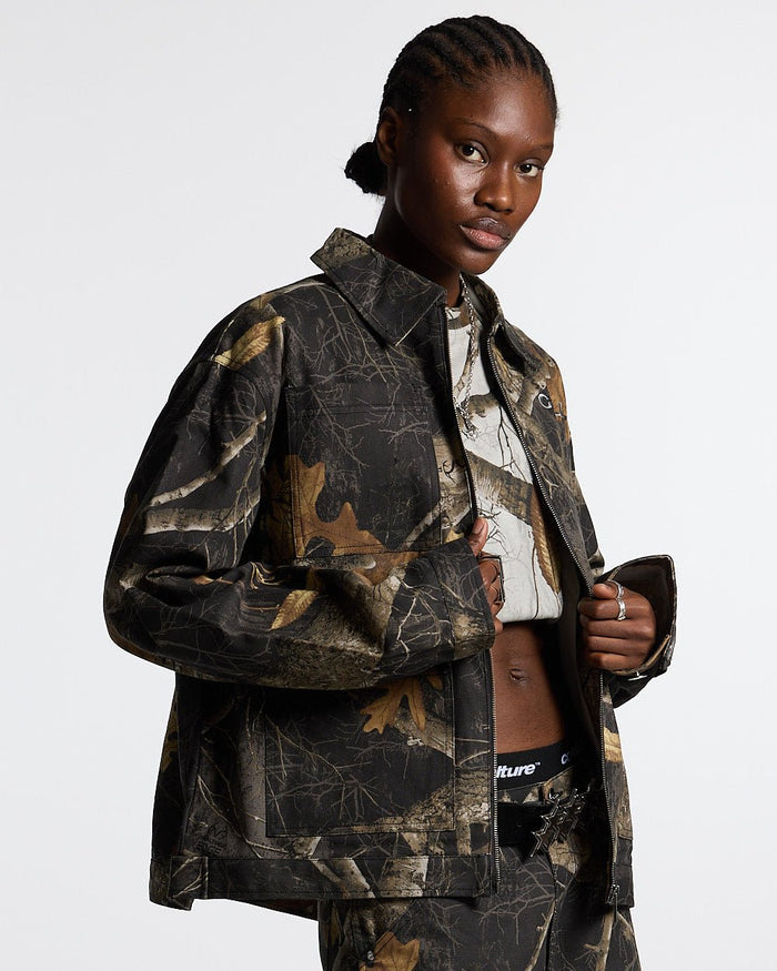 WORK ZIP JACKET REALTREE BLACK - black realtree camo work jacket, front view on female model - Cold Culture #woman