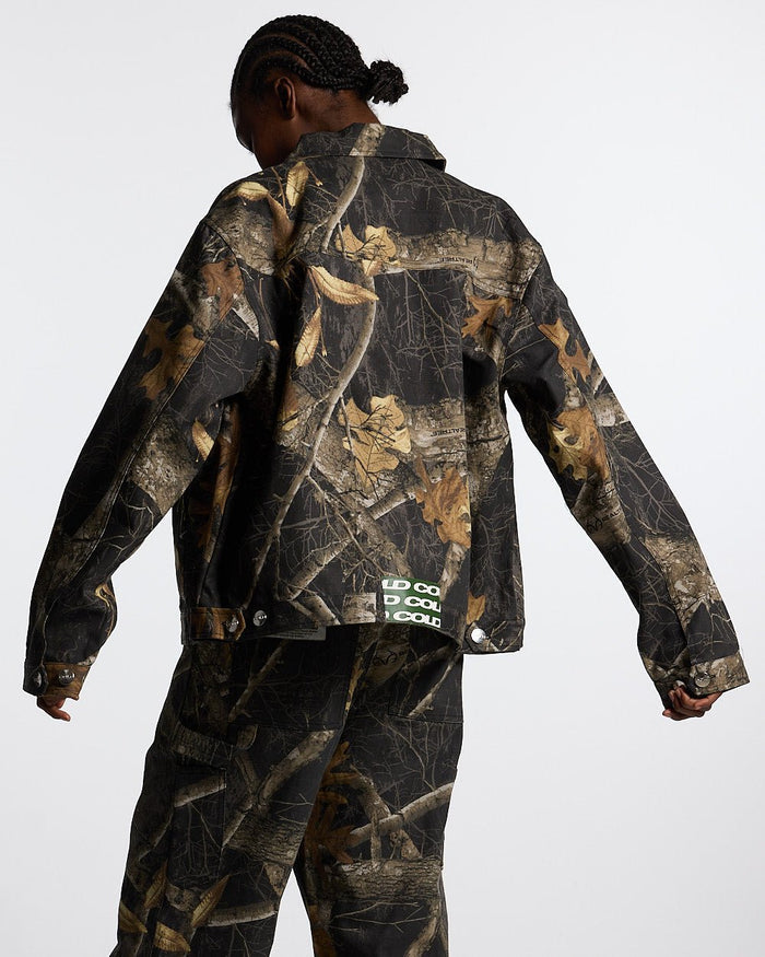 WORK ZIP JACKET REALTREE BLACK - black realtree camo work jacket, back view on female model - Cold Culture #woman